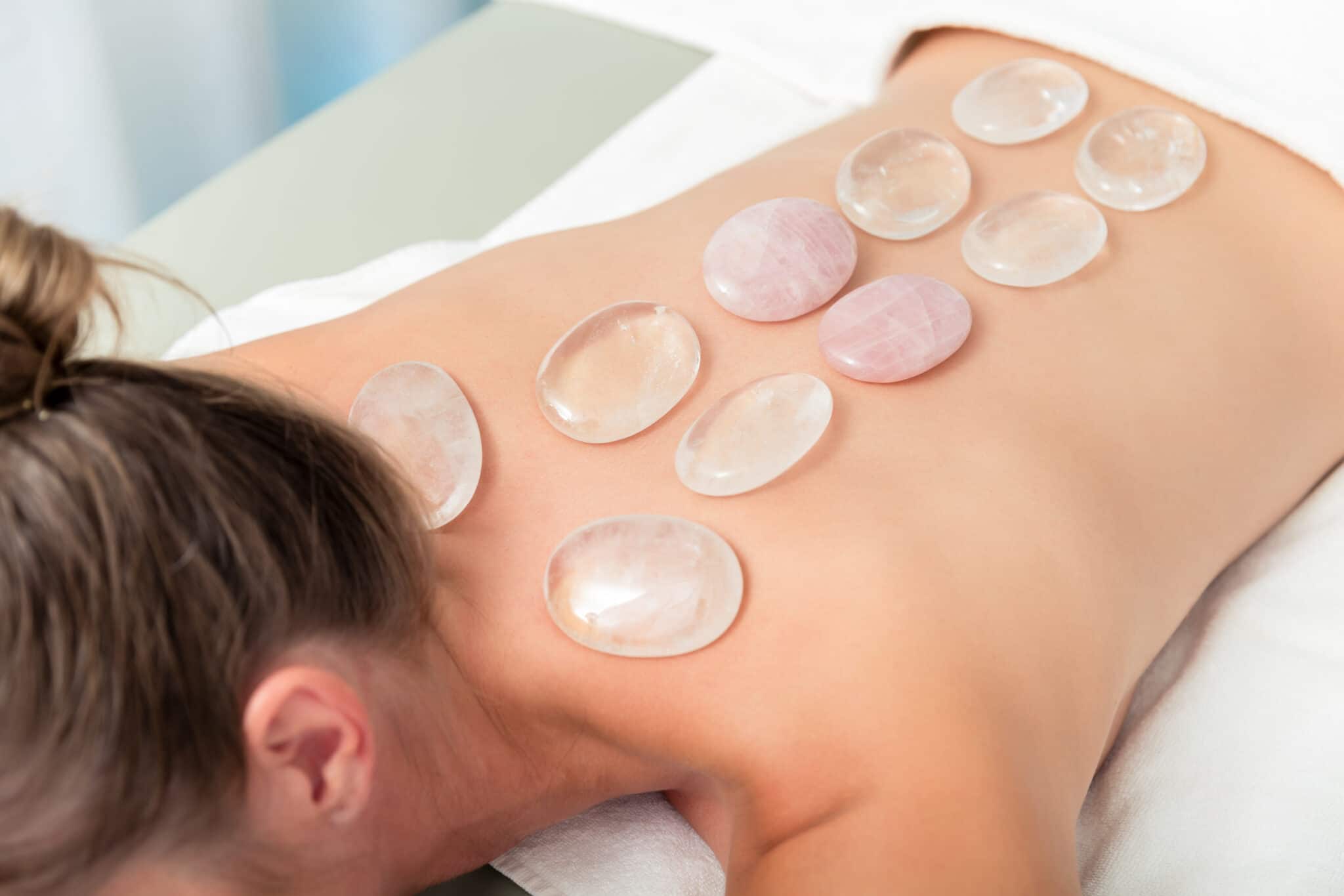 Woman getting hot stone therapy